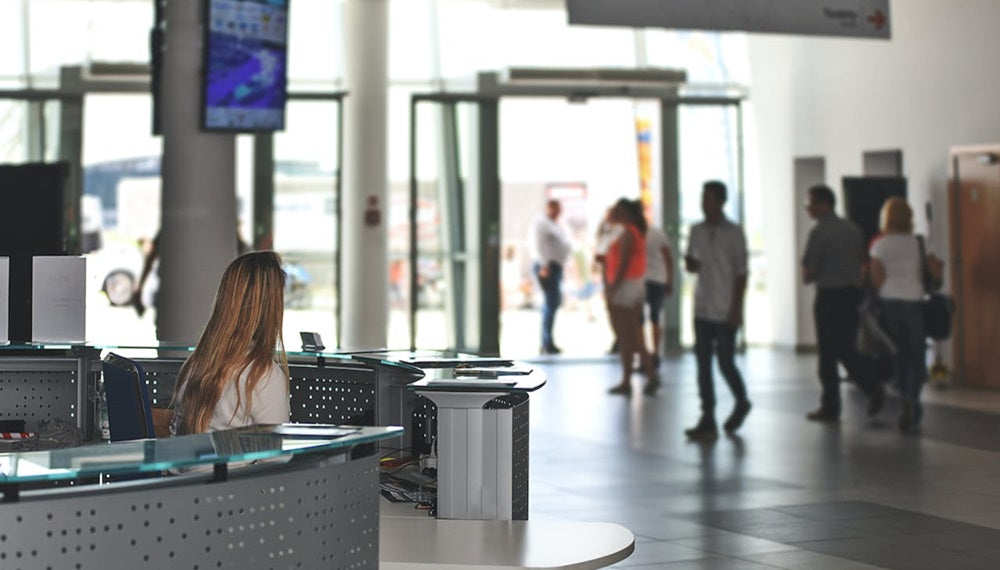 white sitting behind counter under television